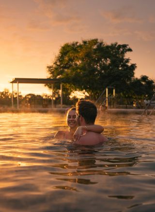 Couple enjoying a visit to the Lightning Ridge Bore Baths, Lightning Ridge