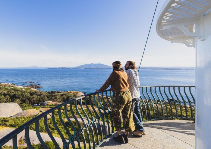Couple enjoys a climb up through the Montague Island Lighthouse part of the Montague Island Discovery Tours experience, Narooma